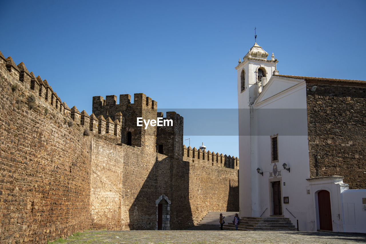 low angle view of old building against clear sky