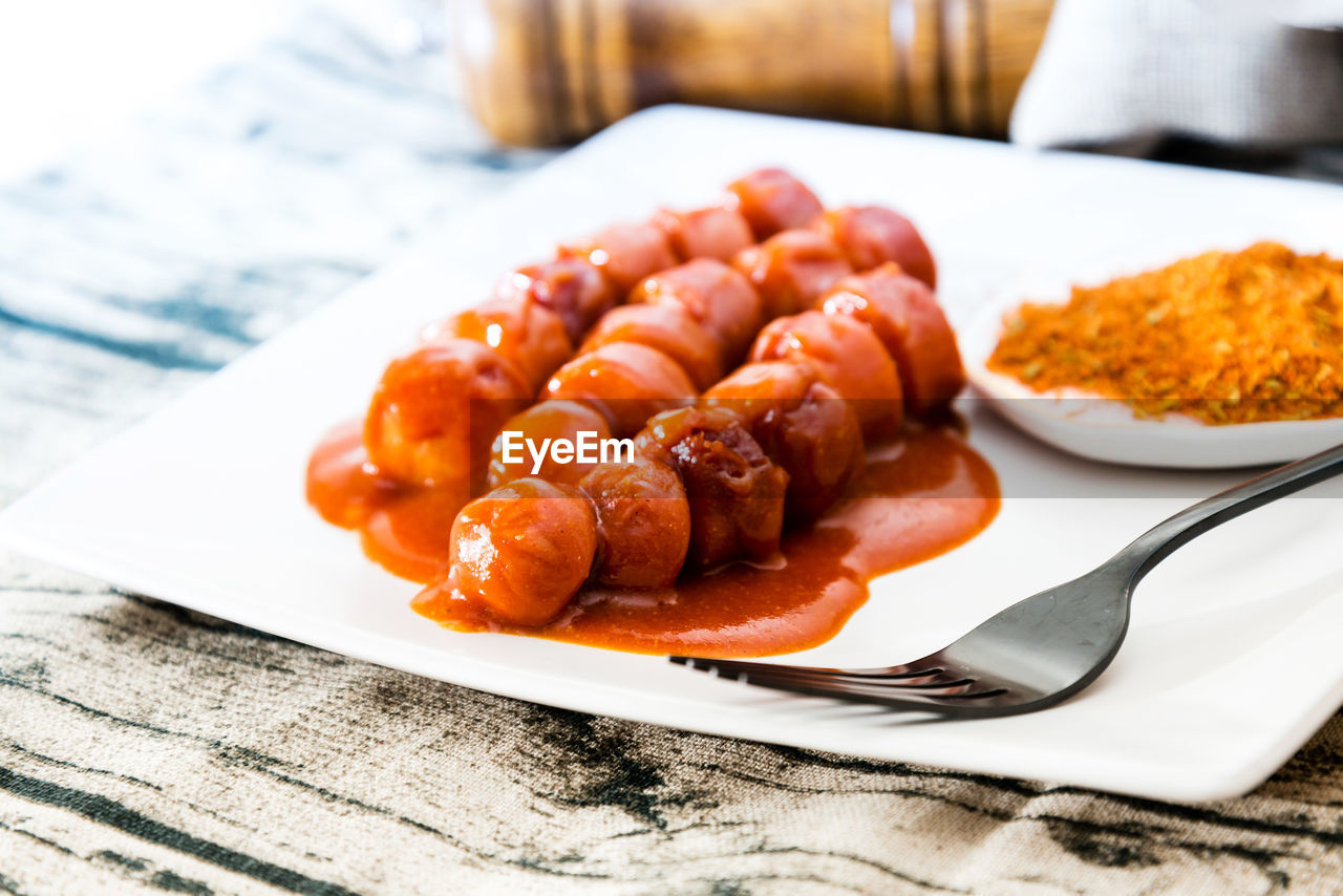 High angle view of sausages in plate