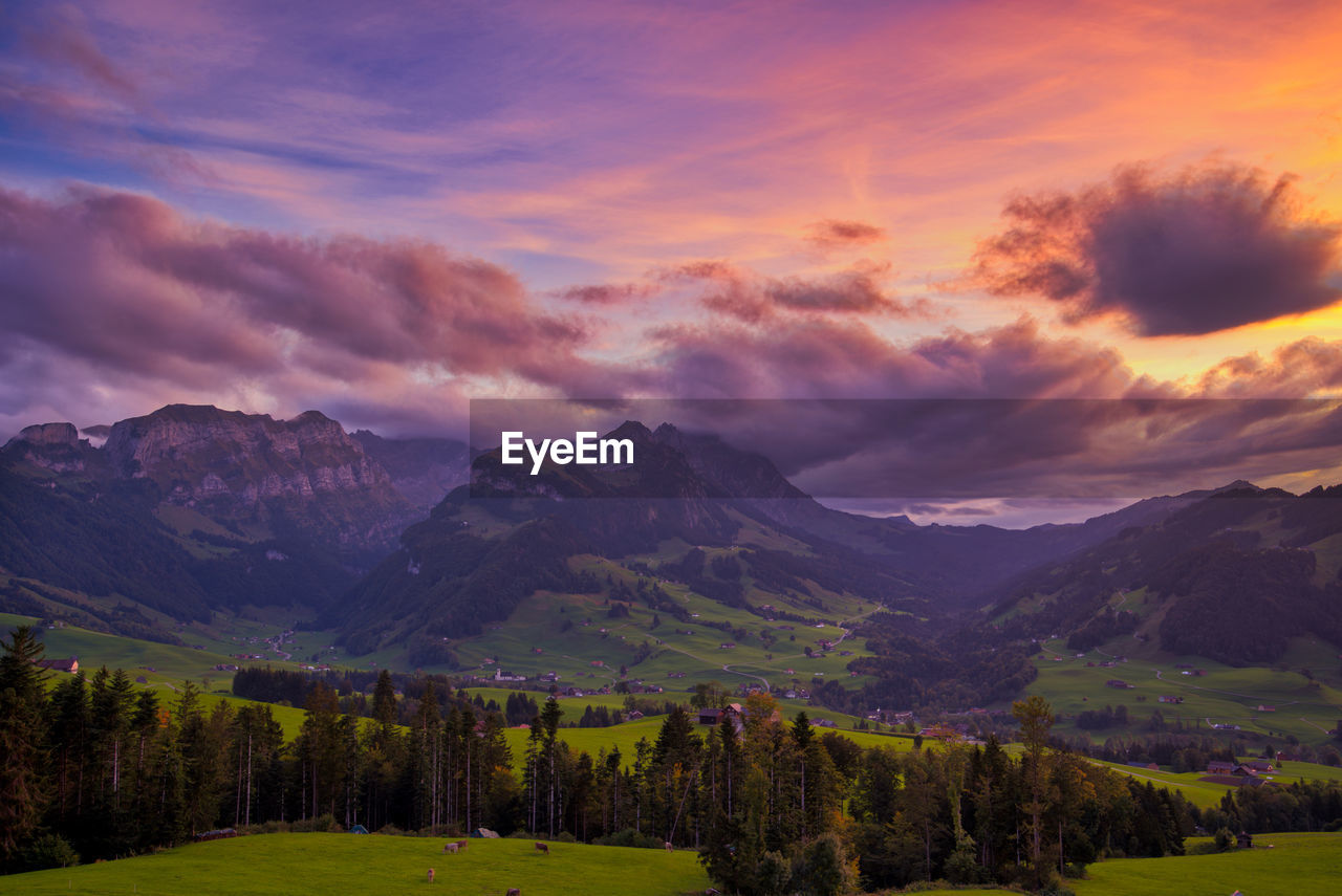 Scenic view of mountains against sky during sunset