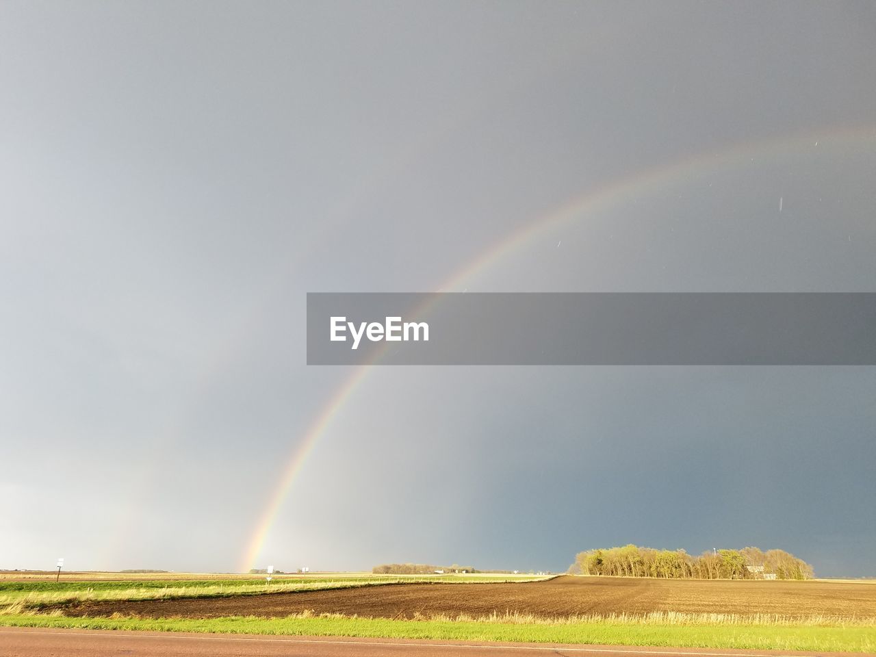 SCENIC VIEW OF RAINBOW OVER LAND