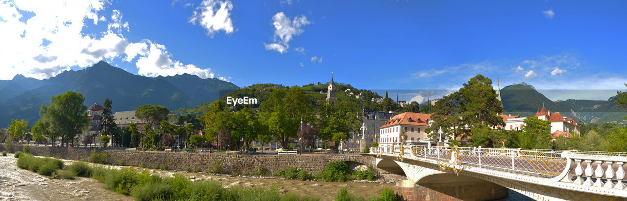 PANORAMIC VIEW OF ARCH BRIDGE AND TREES AGAINST SKY