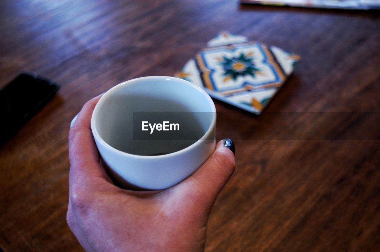 High angle view of coffee cup on table