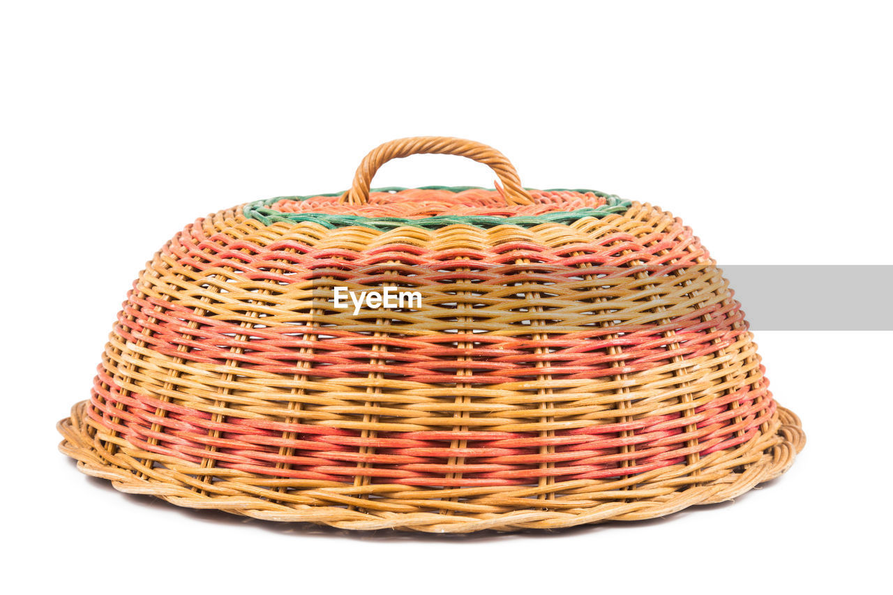 Close-up of wicker lid on white background