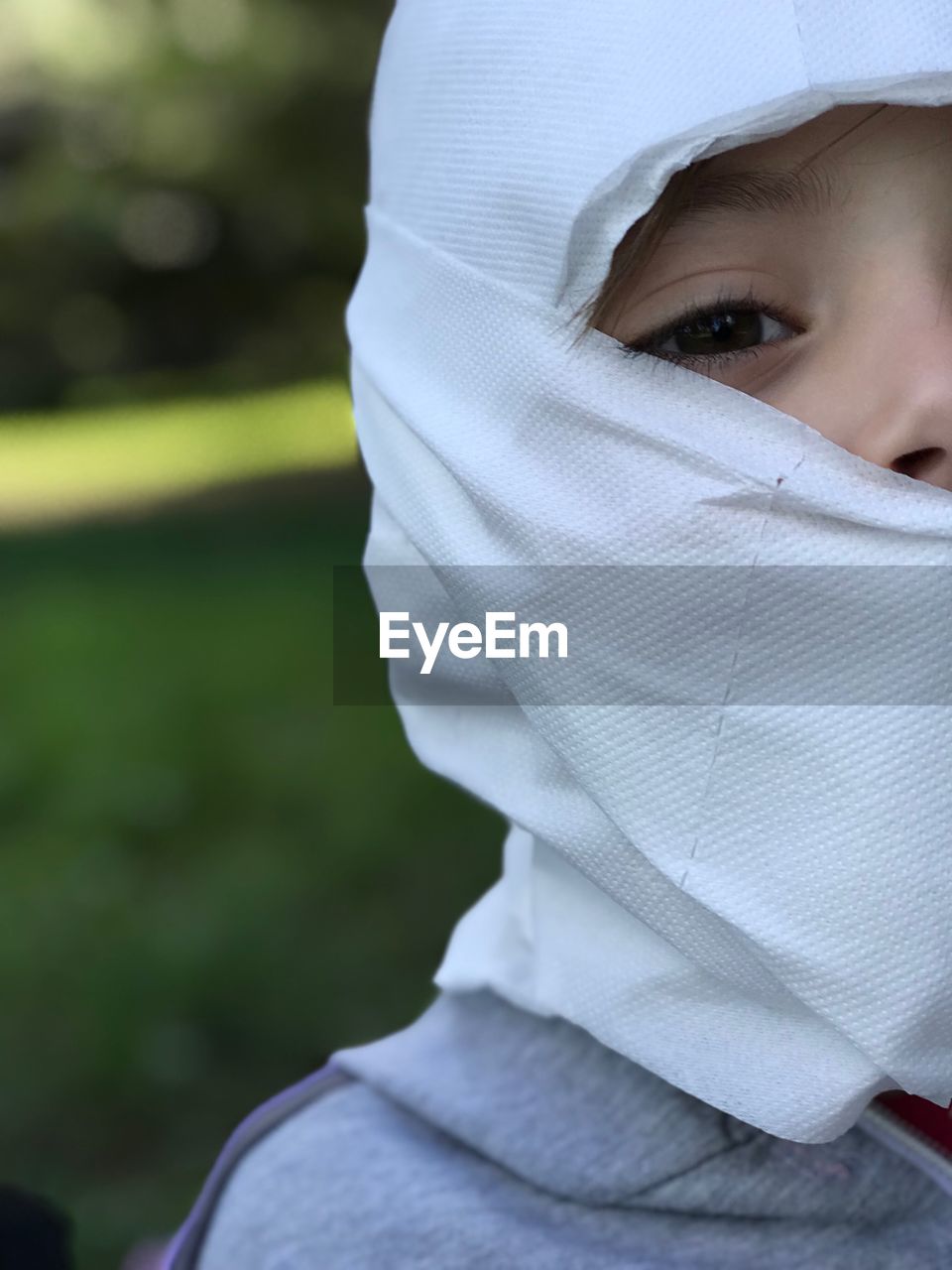 CLOSE-UP PORTRAIT OF BOY WEARING MASK