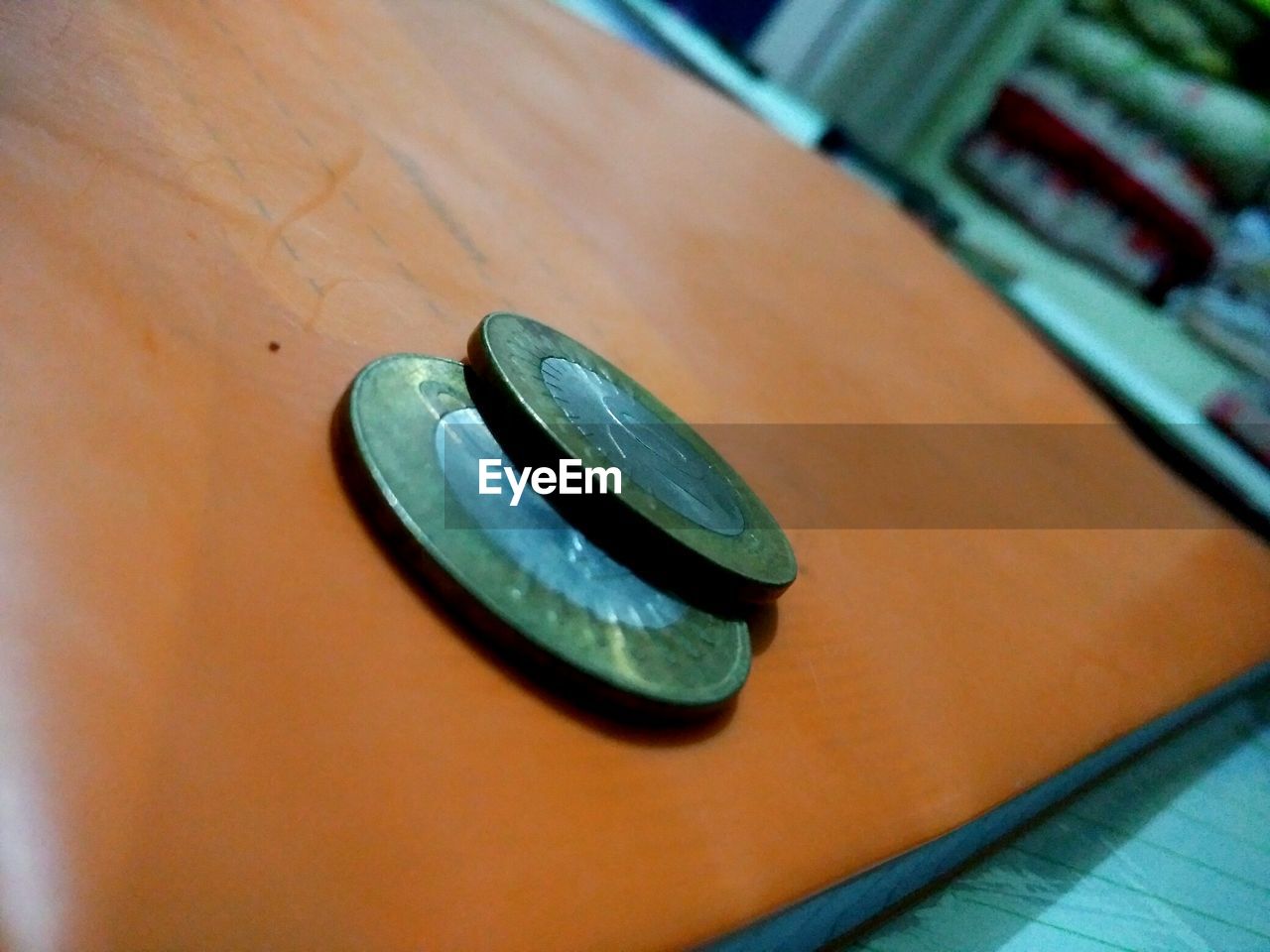 Close-up of coins on table