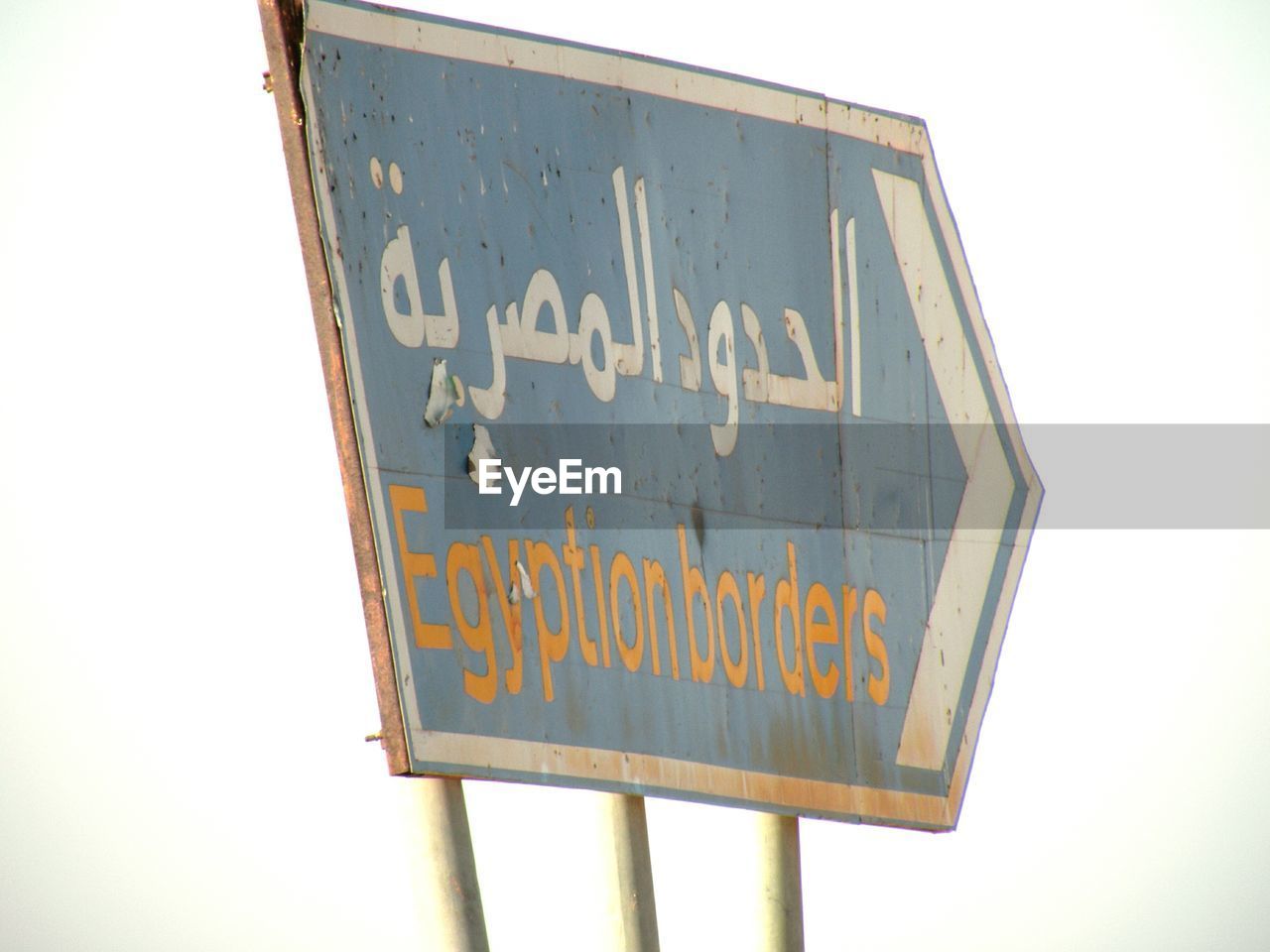 Low angle view of information sign against clear sky