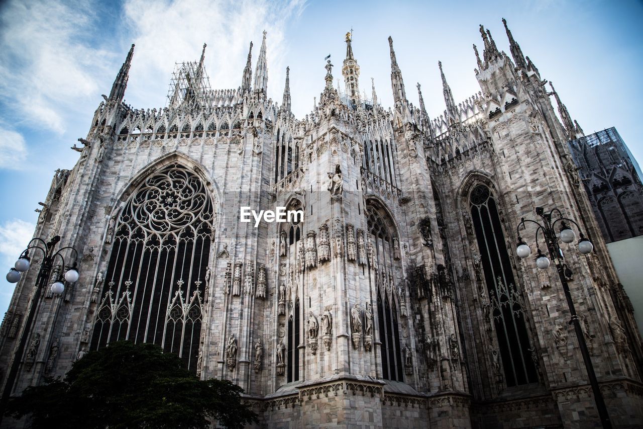 Low angle view of milan cathedral against sky