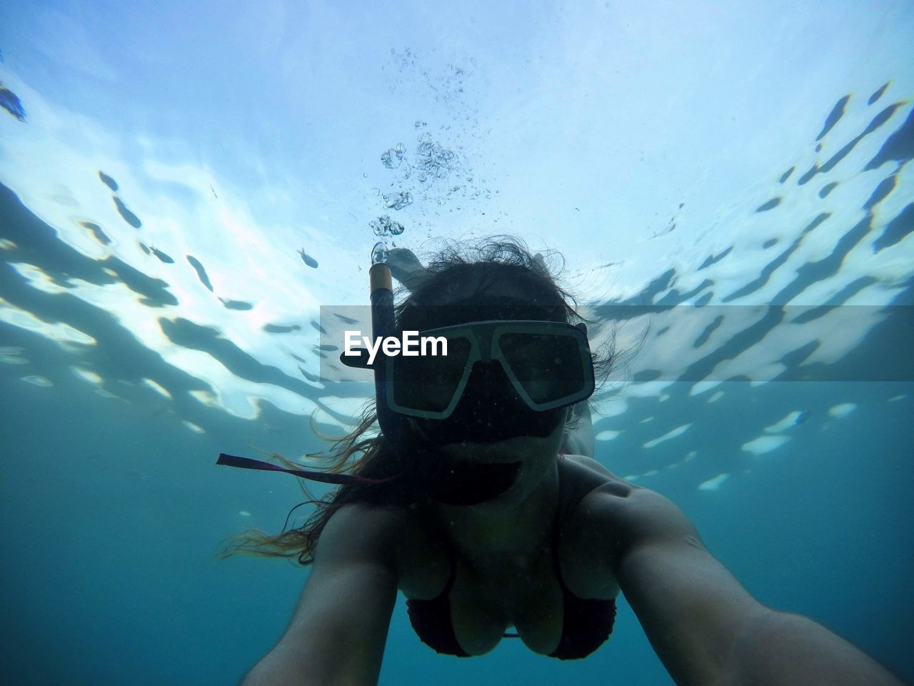 Woman swimming in sea