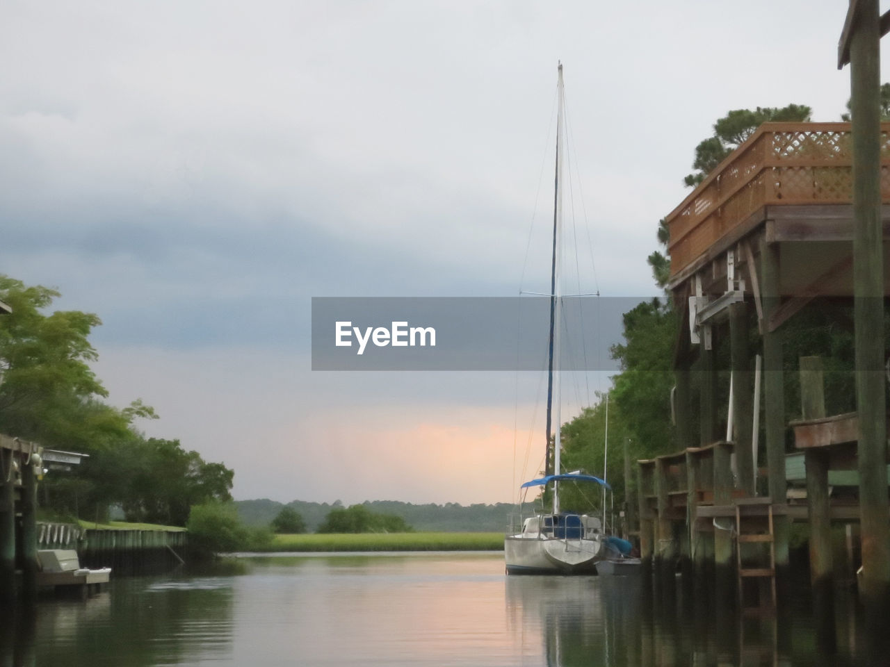 BOATS MOORED IN RIVER