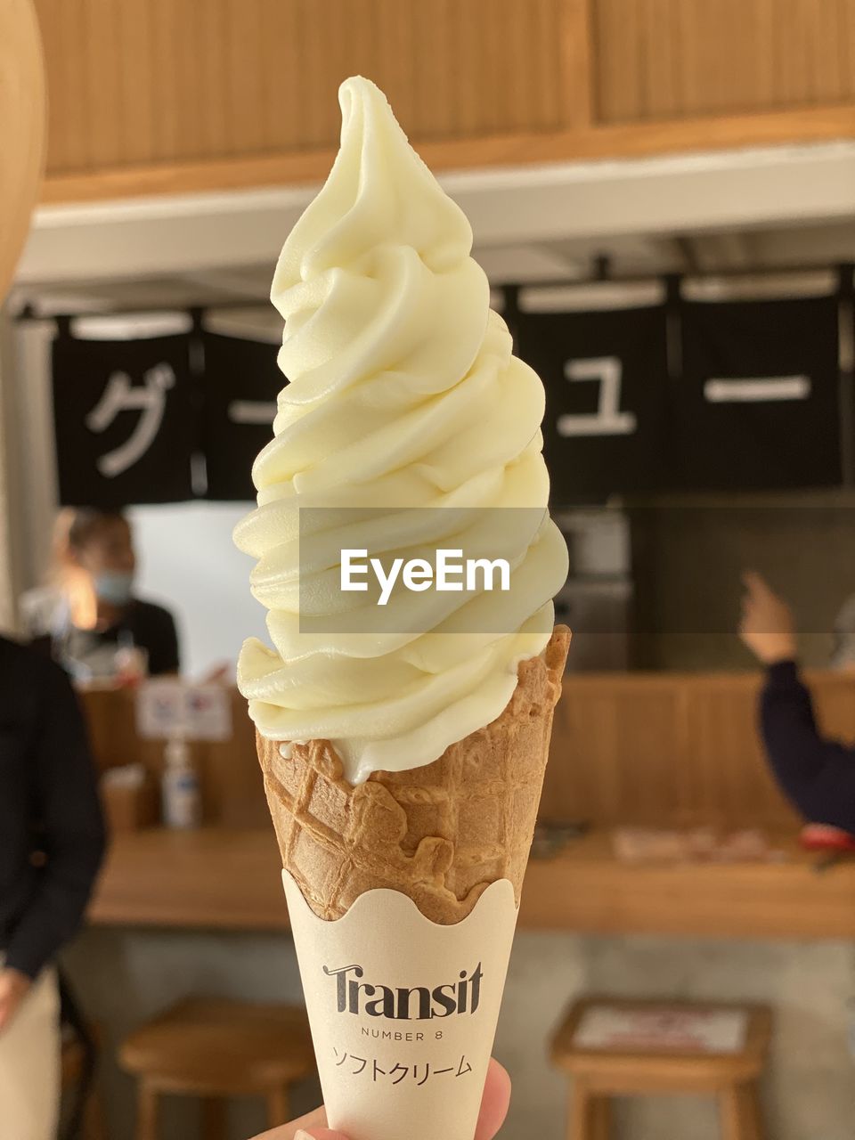 CLOSE-UP OF ICE CREAM CONE ON TABLE