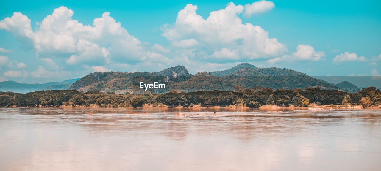 Panoramic view of sea and land against sky