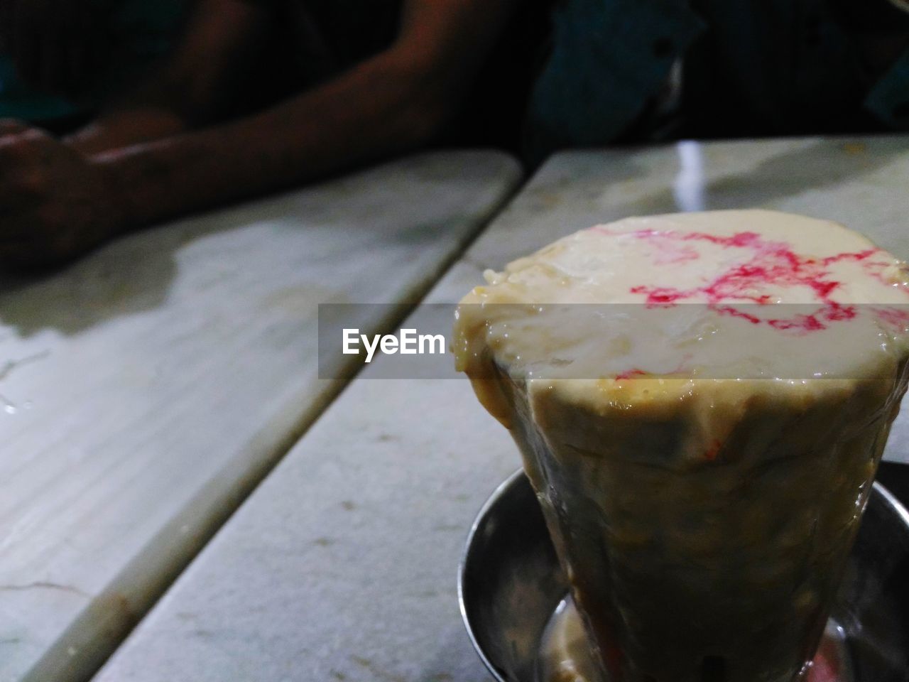 CLOSE-UP OF ICE CREAM ON TABLE