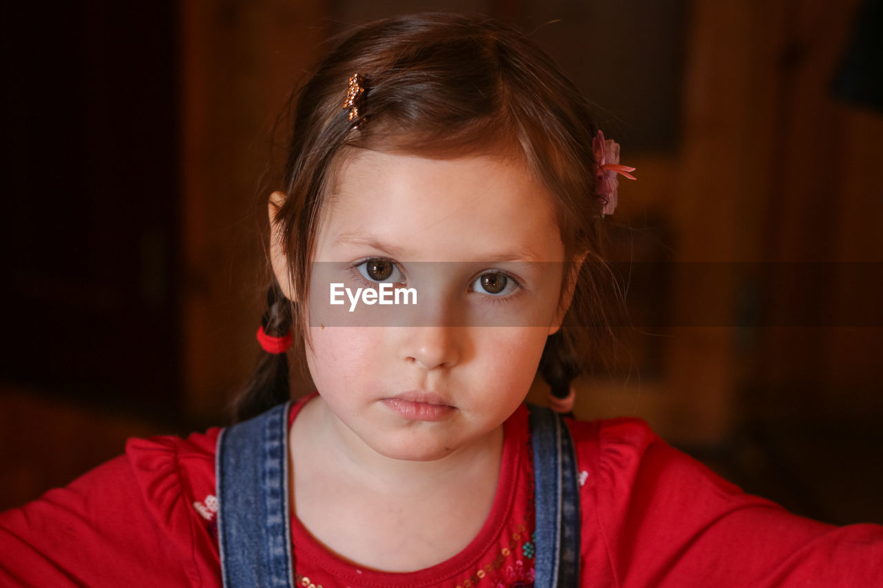 Portrait of a young five year old girl with expressive eyes and pure innocence. a little girl