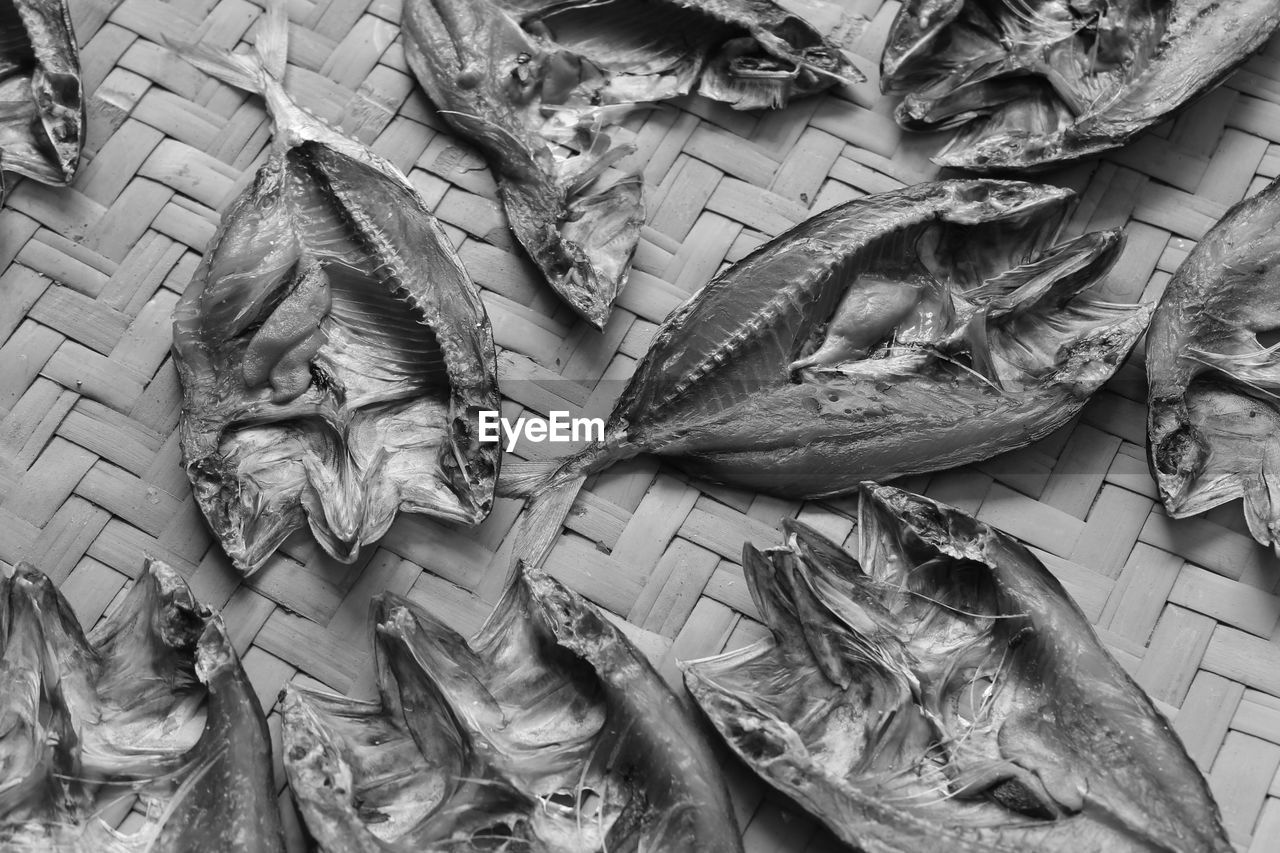 High angle view of dried fish on wicker plate