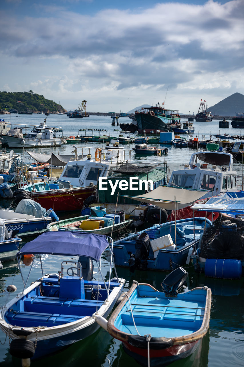 BOATS MOORED IN HARBOR