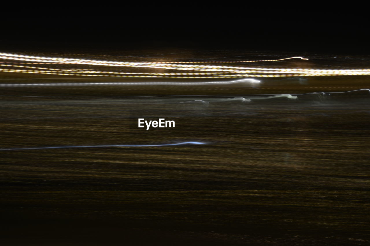 Lights on the beach  at night abstract 