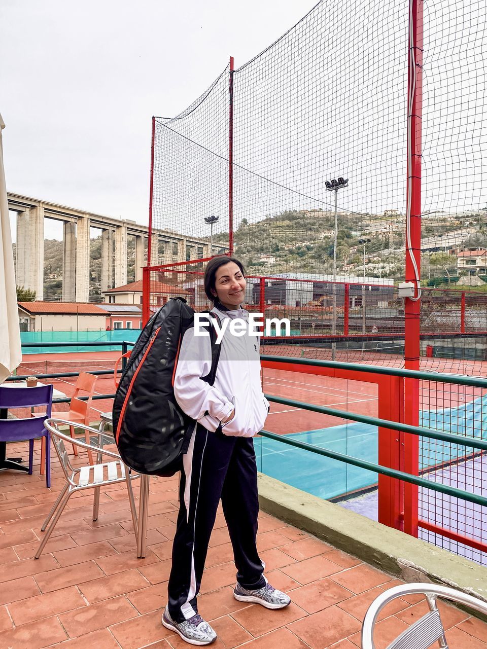 Full length of young woman standing in city