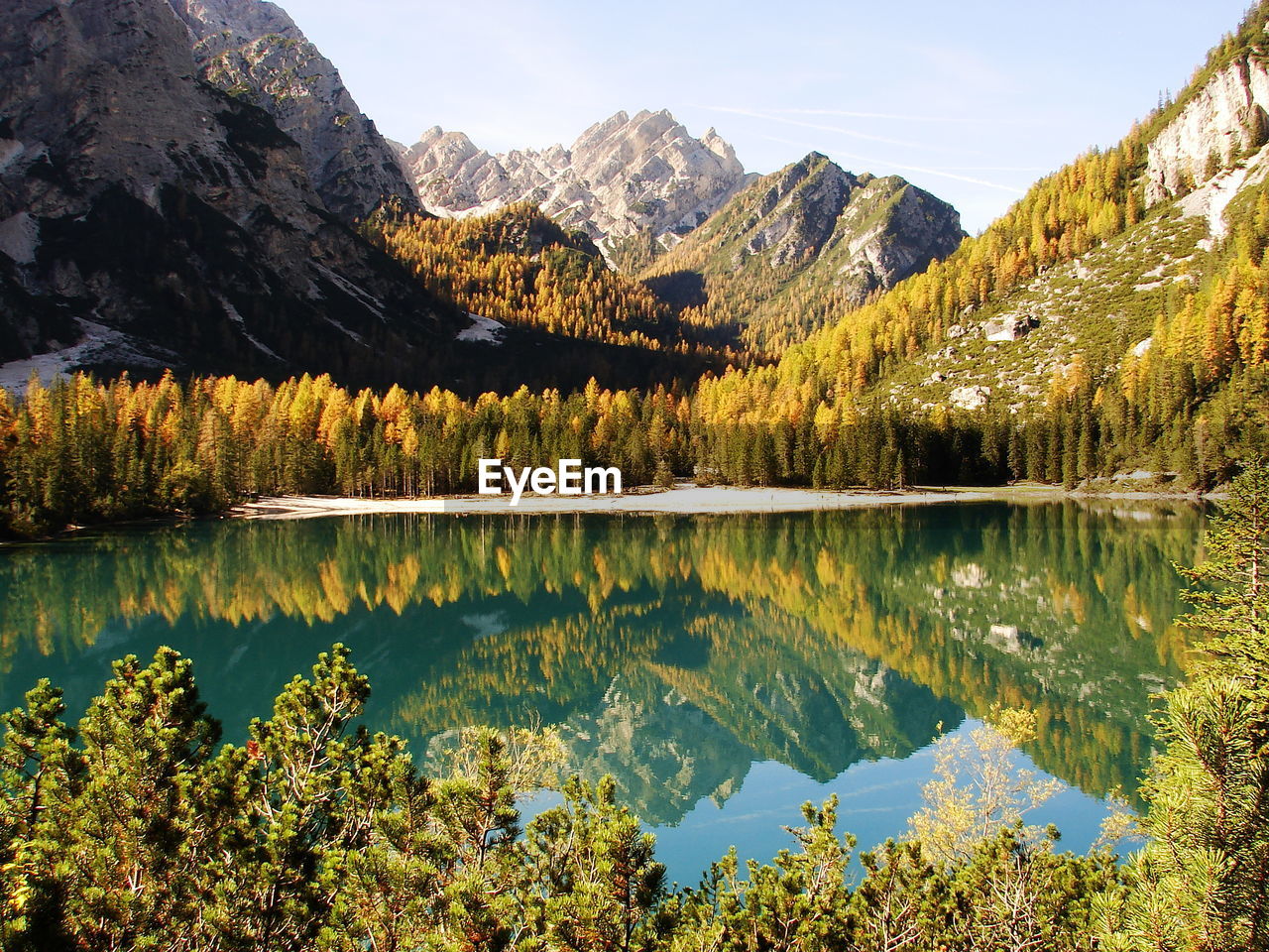 Scenic view of lake and mountains against sky