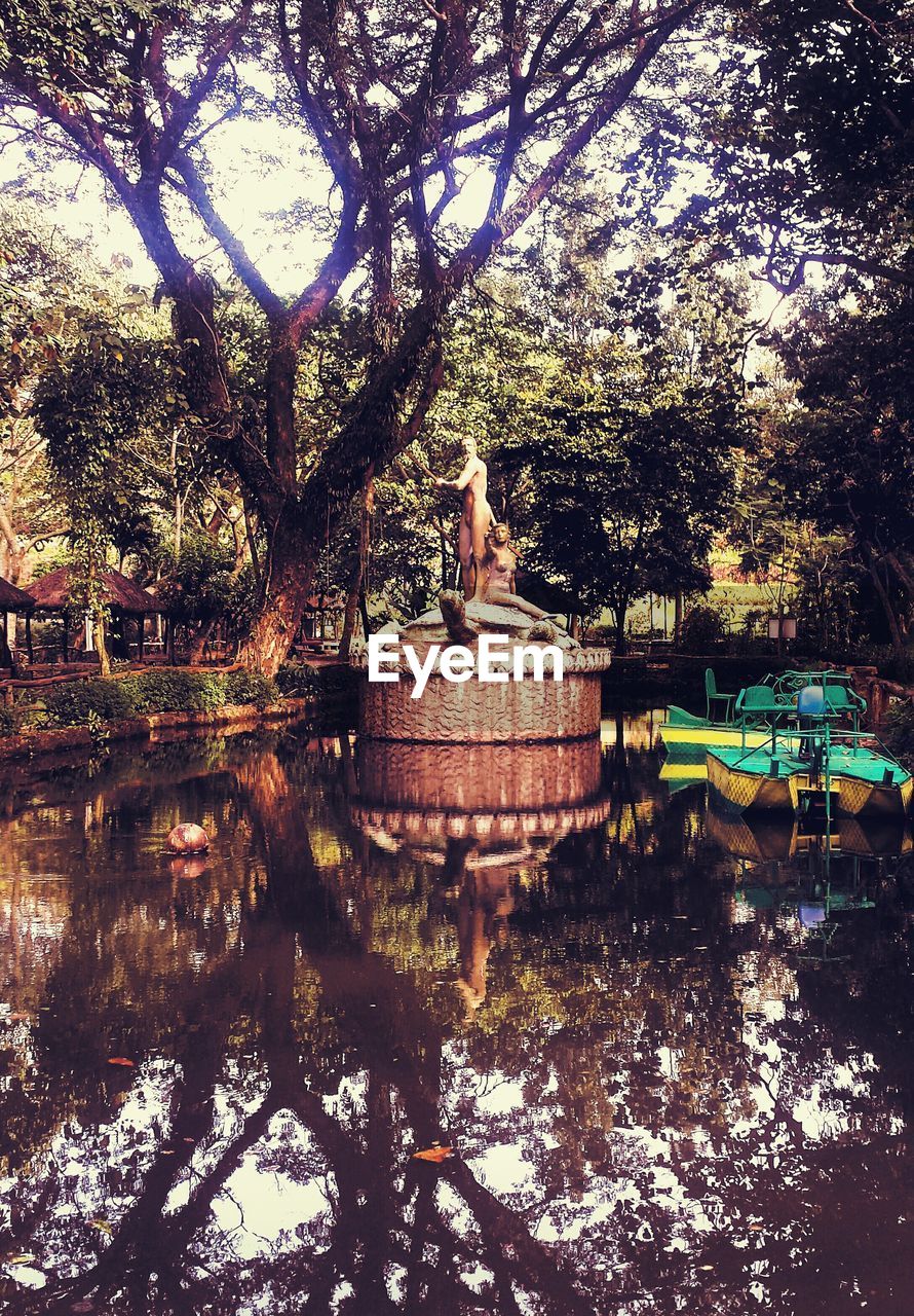 Sculptures in pond at park