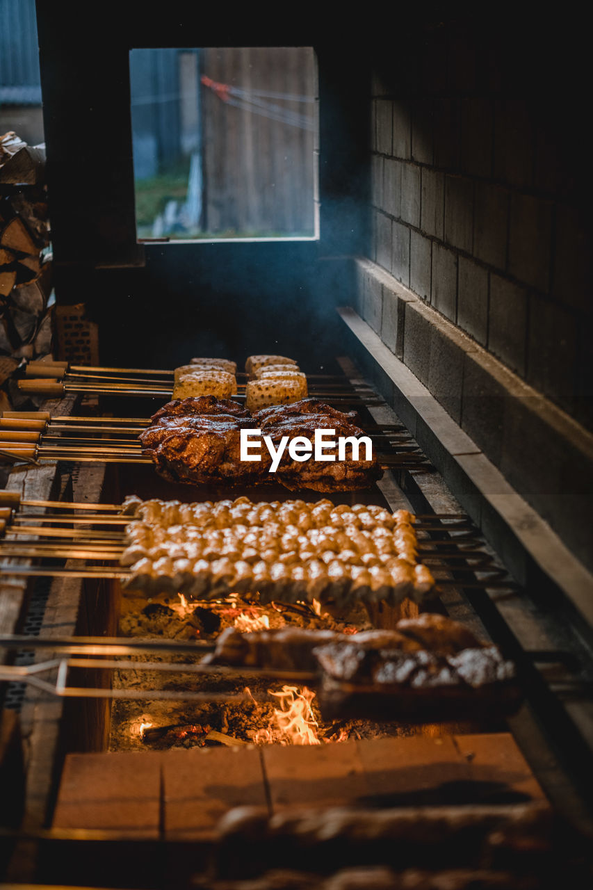 High angle view of meat on barbecue grill