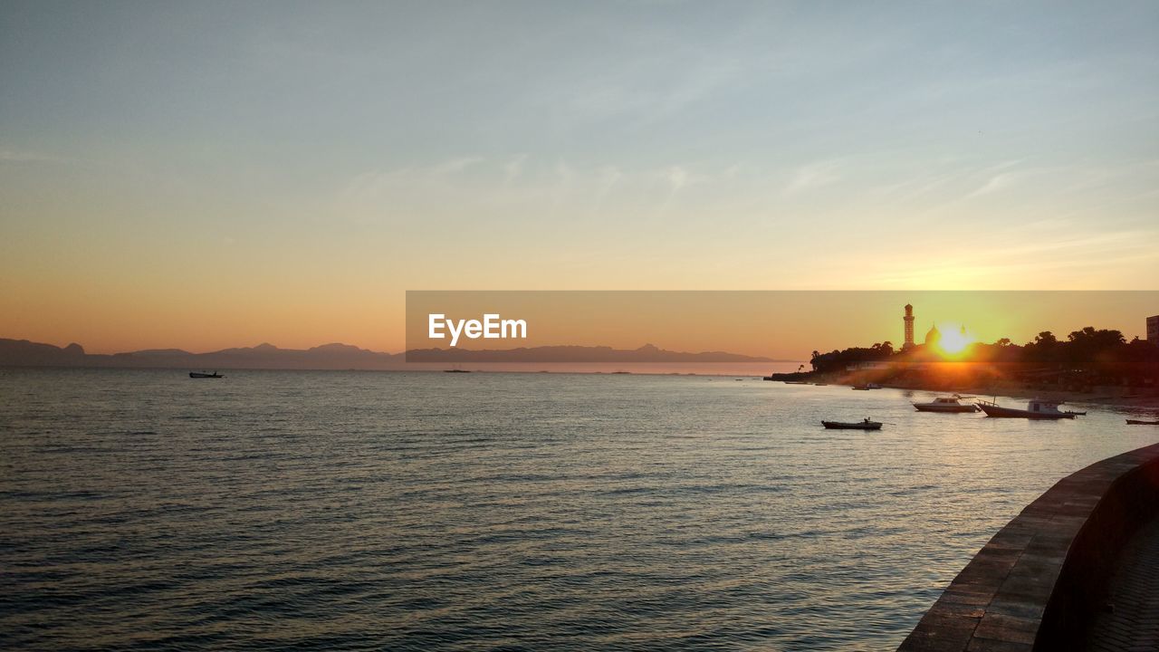 SCENIC VIEW OF SEA DURING SUNSET