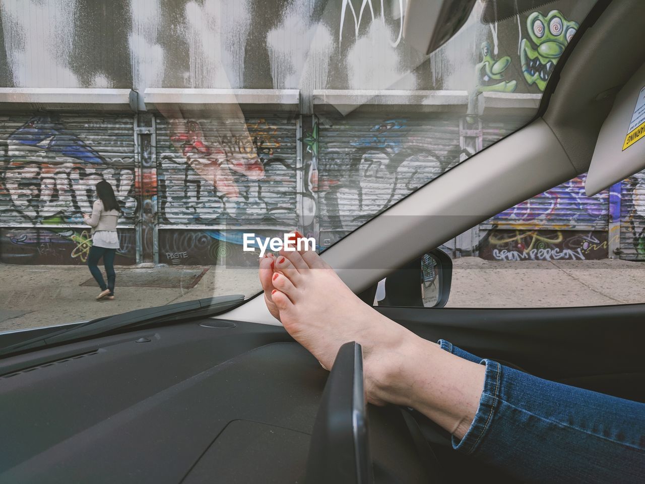 Woman feet in car dashboard