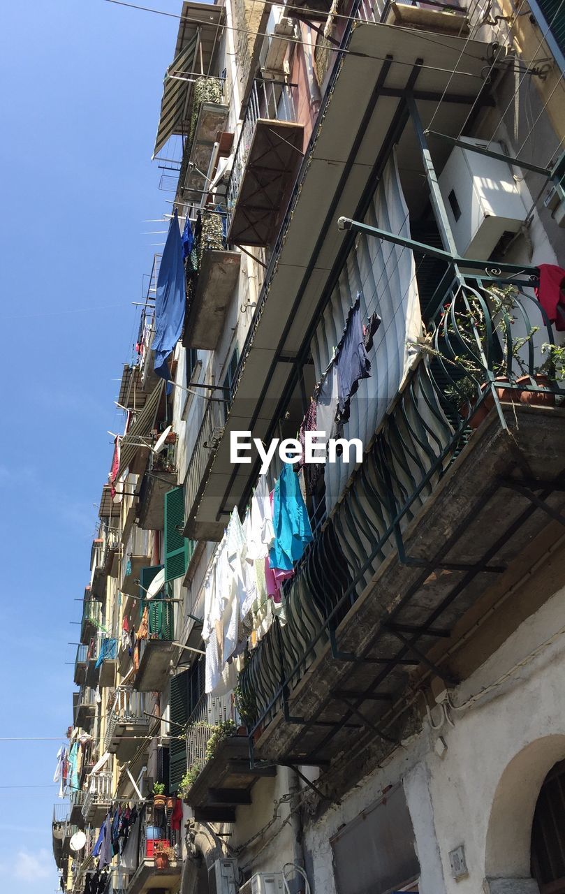 LOW ANGLE VIEW OF CLOTHES DRYING ON CLOTHESLINE