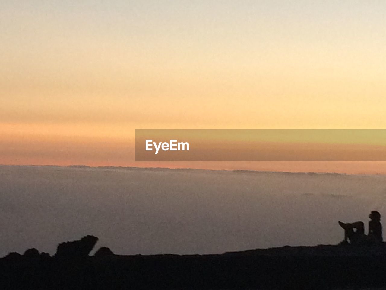 SILHOUETTE OF LANDSCAPE AGAINST SKY DURING SUNSET