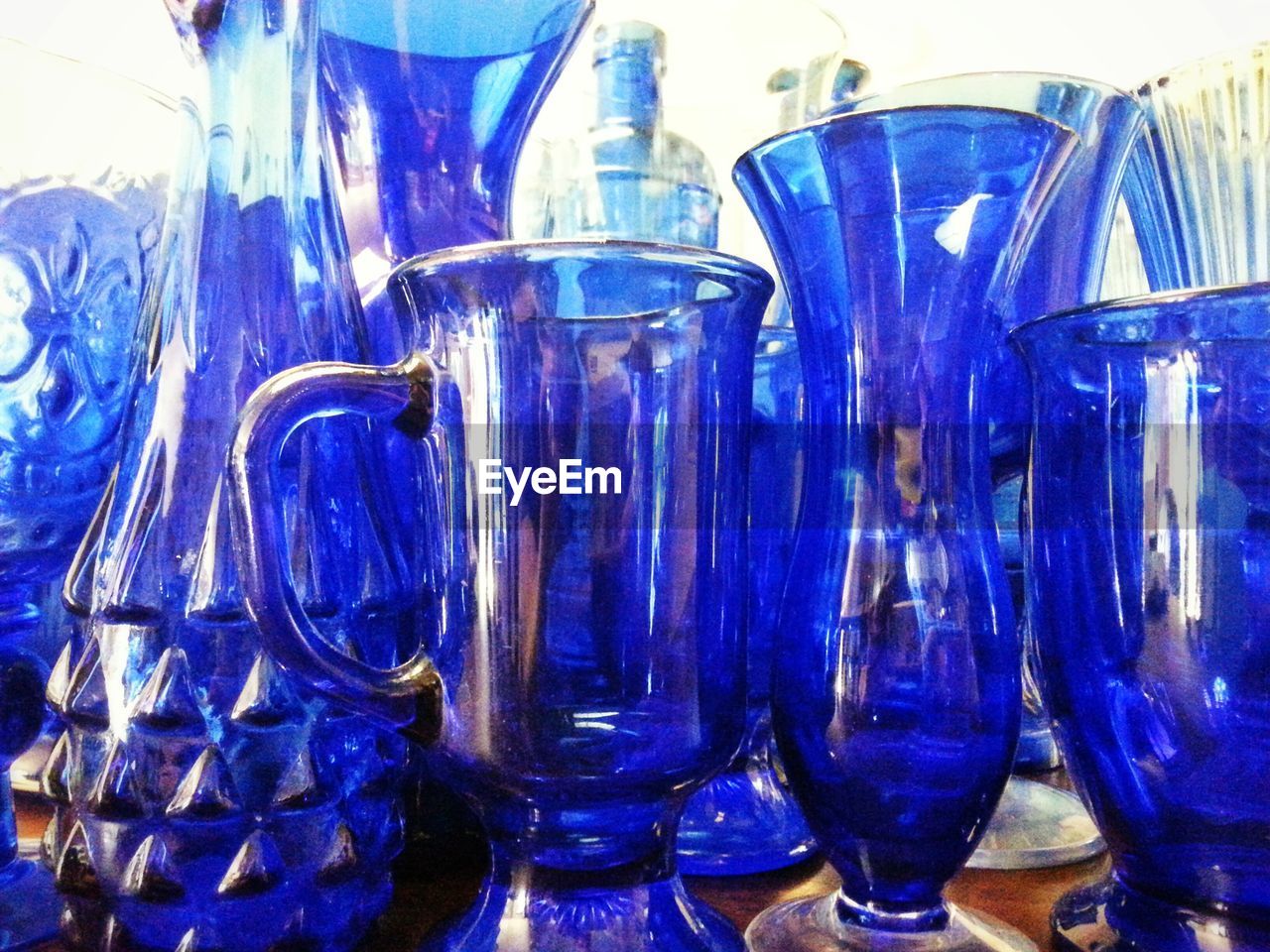 CLOSE-UP OF BOTTLES ON TABLE