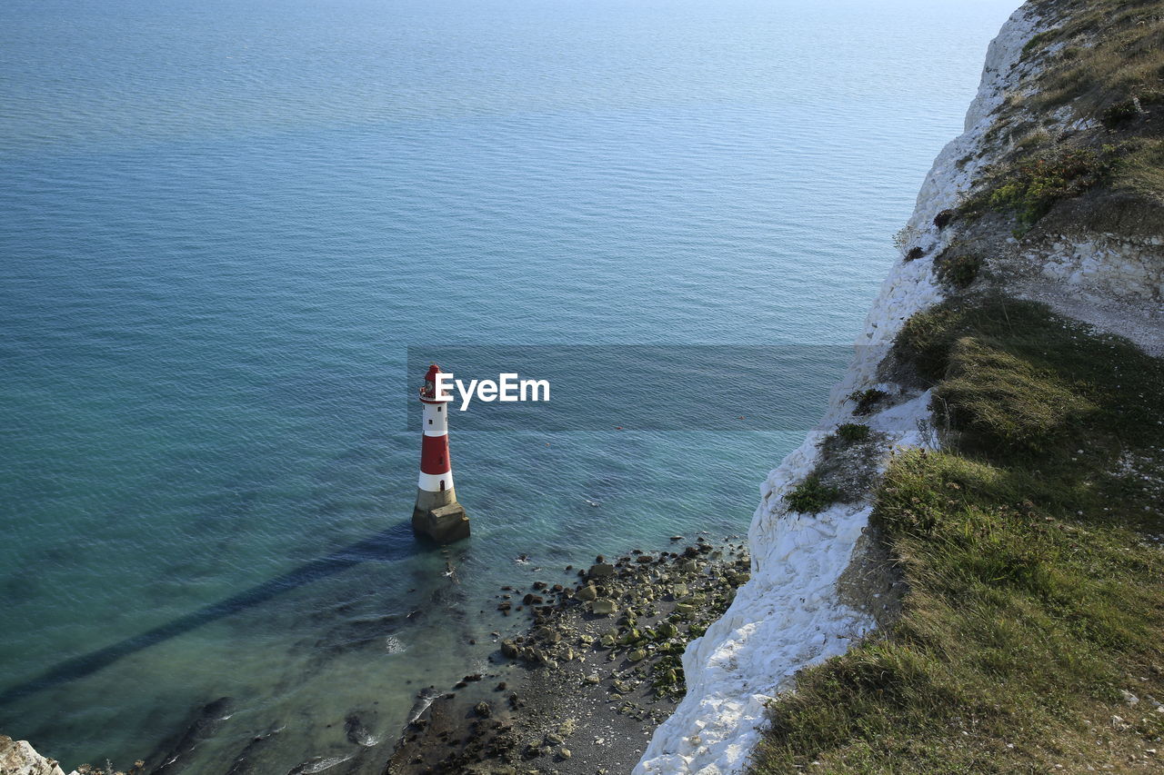 High angle view of lighthouse by sea