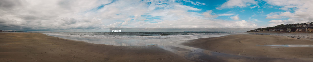 Panoramic view of beach against sky