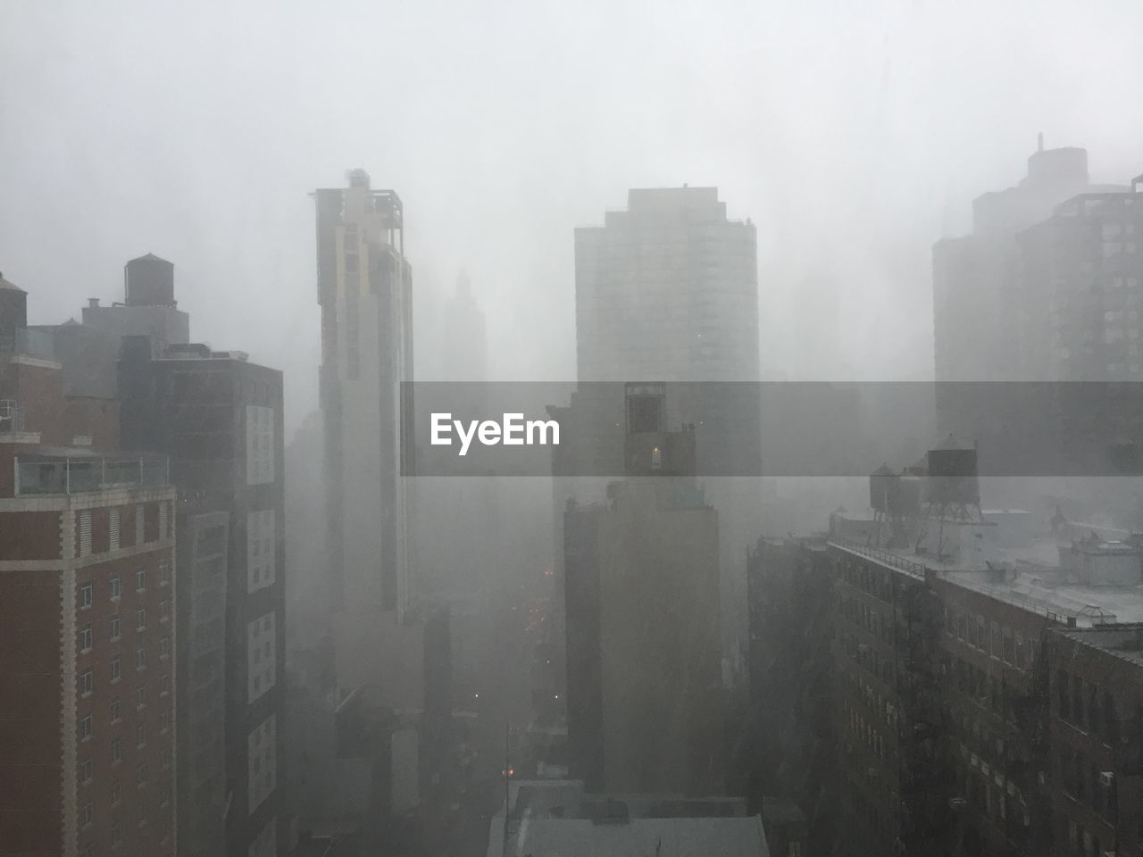 VIEW OF CITYSCAPE IN FOGGY WEATHER