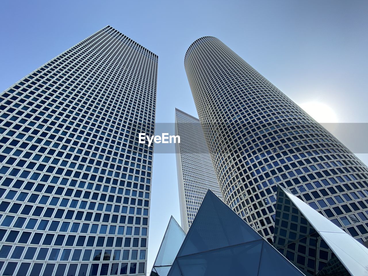 Low angle view of modern buildings against clear sky in city