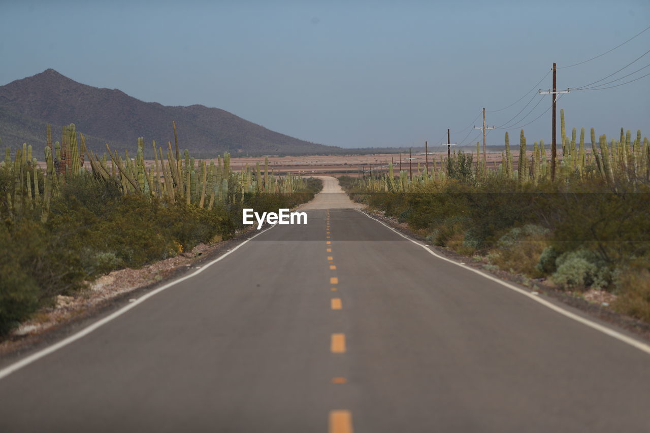 EMPTY ROAD AGAINST SKY