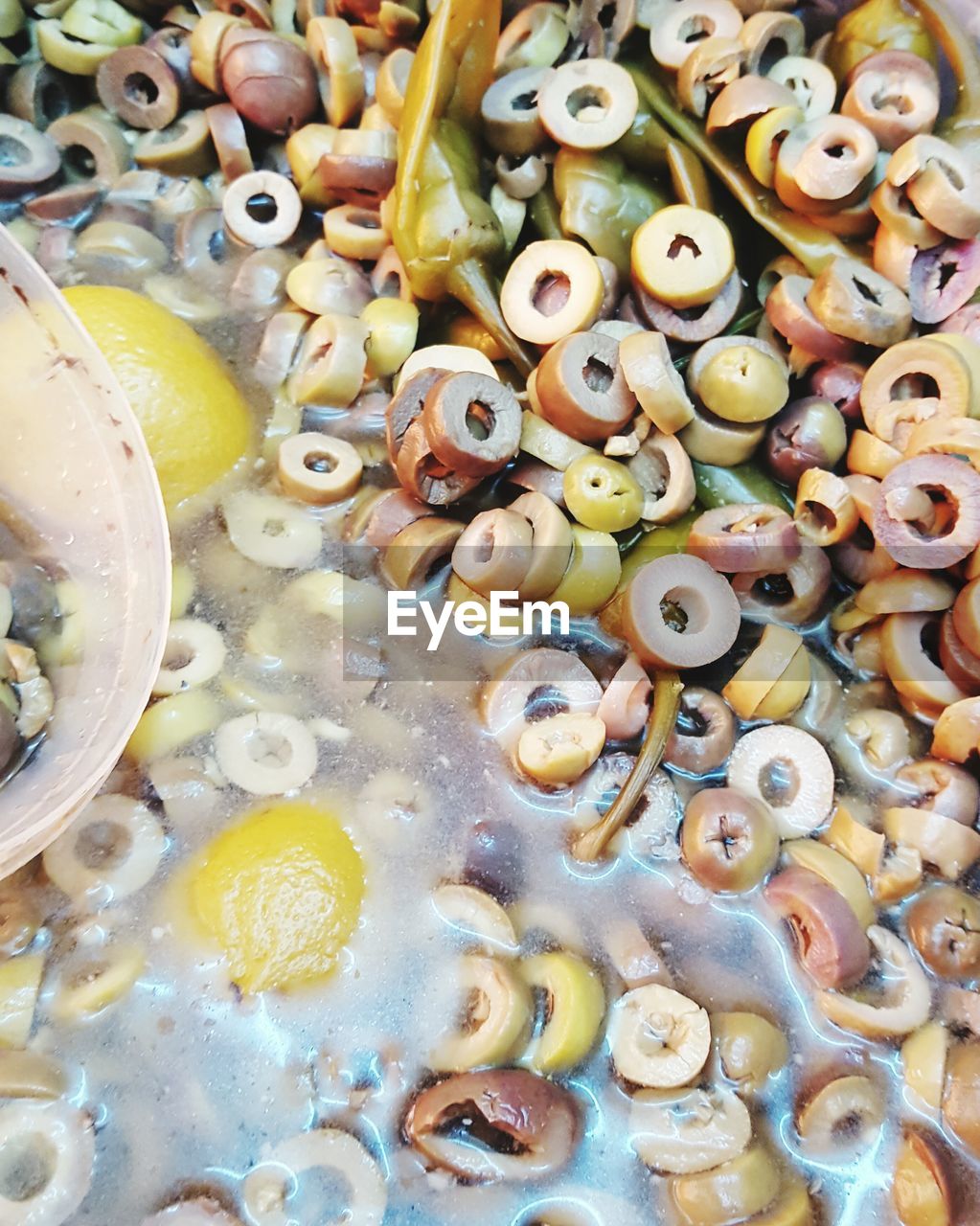 High angle view of olives and lemon