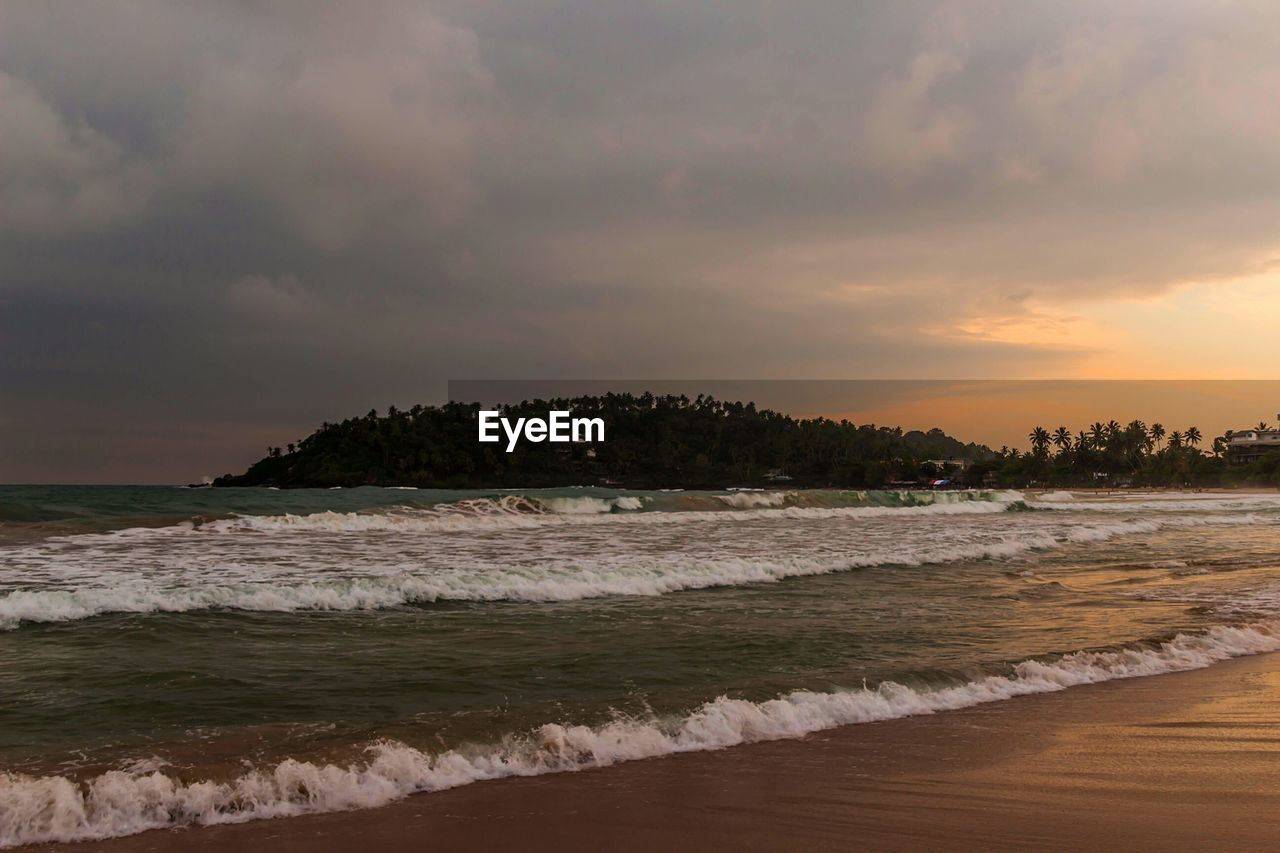 SCENIC VIEW OF BEACH AND SEA AGAINST SKY