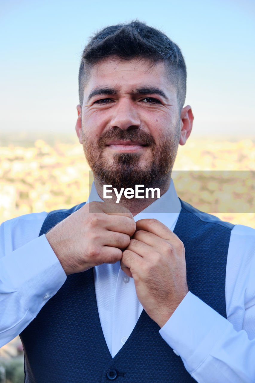 Portrait of man standing outdoors