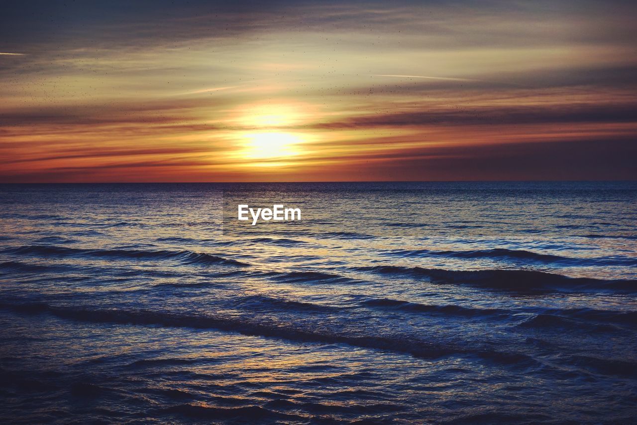 Scenic view of sea against sky during sunset