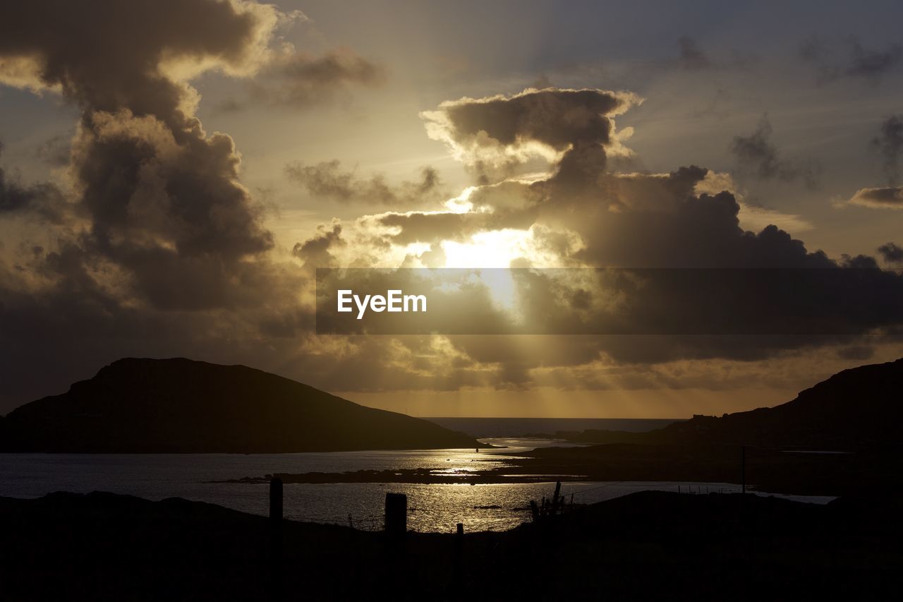 Scenic view of silhouette mountains against sky during sunset