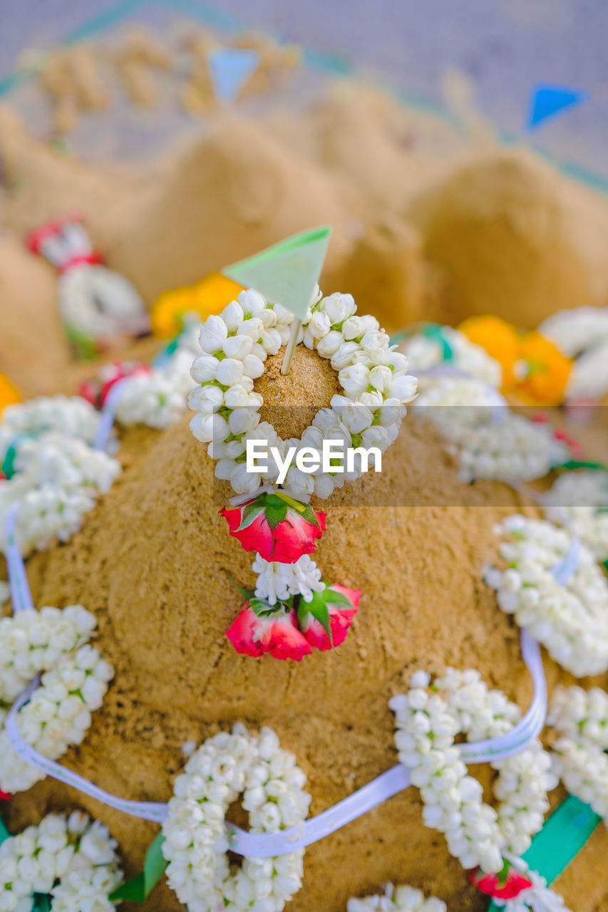 Close-up of garland on sand pagoda
