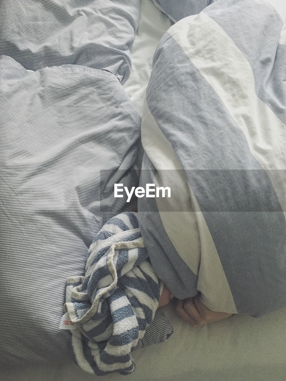 Person lying on bed