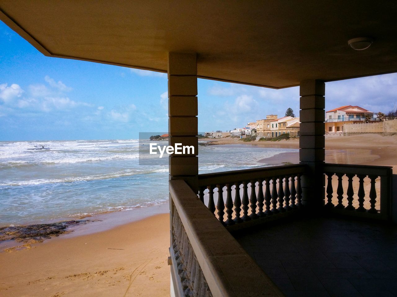 SCENIC VIEW OF SEA WITH MOUNTAIN IN BACKGROUND