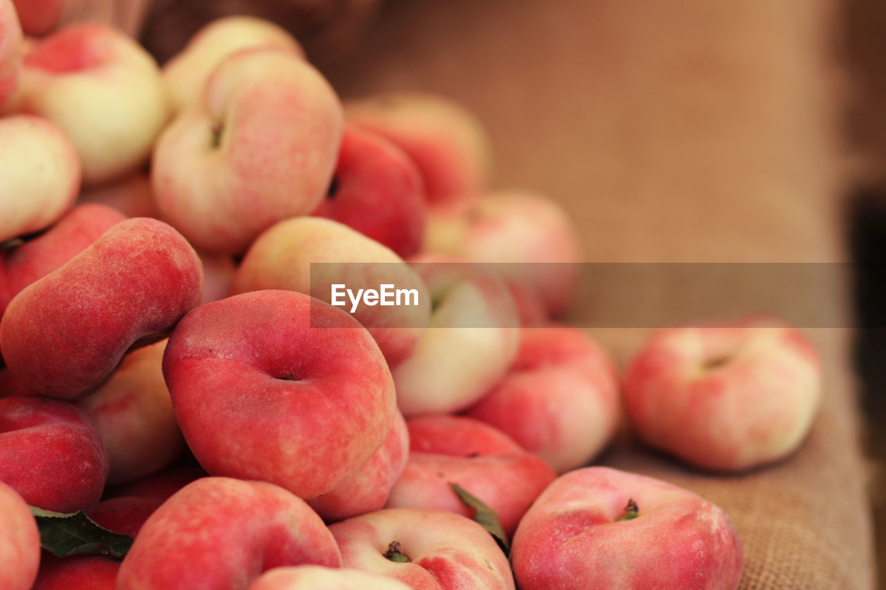 Saturn peaches for sale at market stall