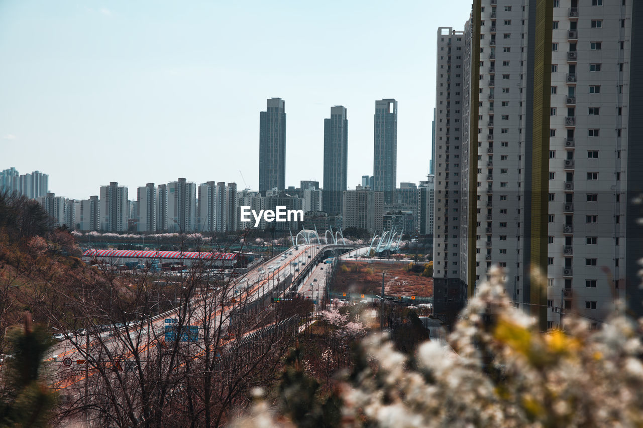 Panoramic view of city buildings against sky