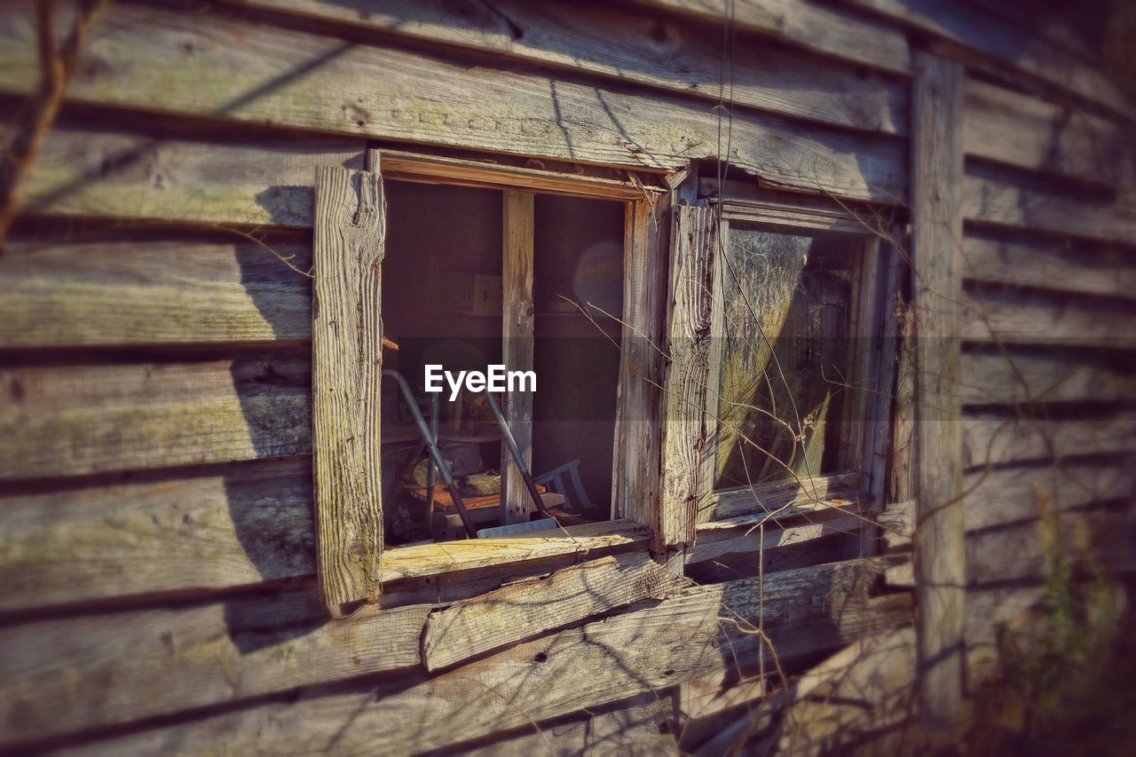 Close-up of window at old wooden house