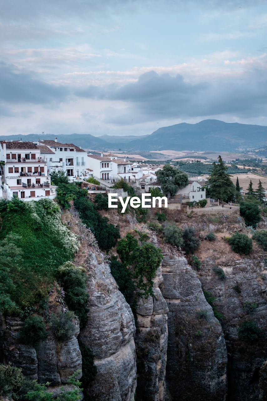 Scenic view of buildings in city against sky