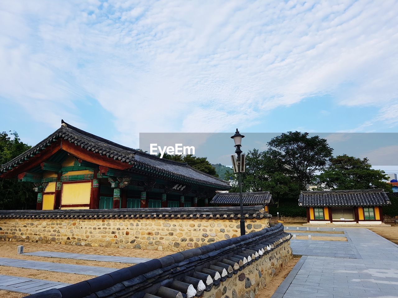 View of temple building against cloudy sky