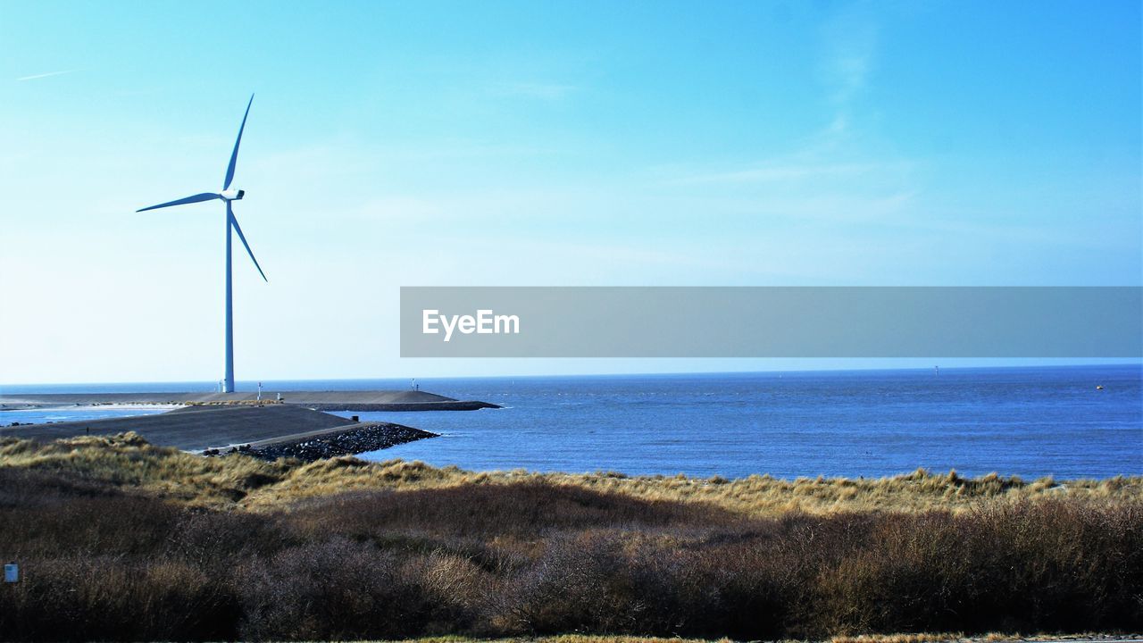 SCENIC VIEW OF SEA SHORE AGAINST SKY
