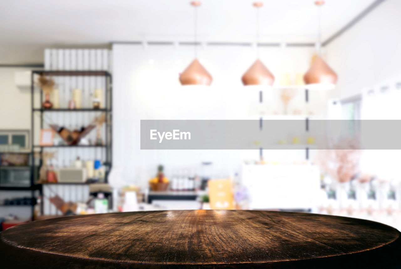 Close-up of wooden table at home