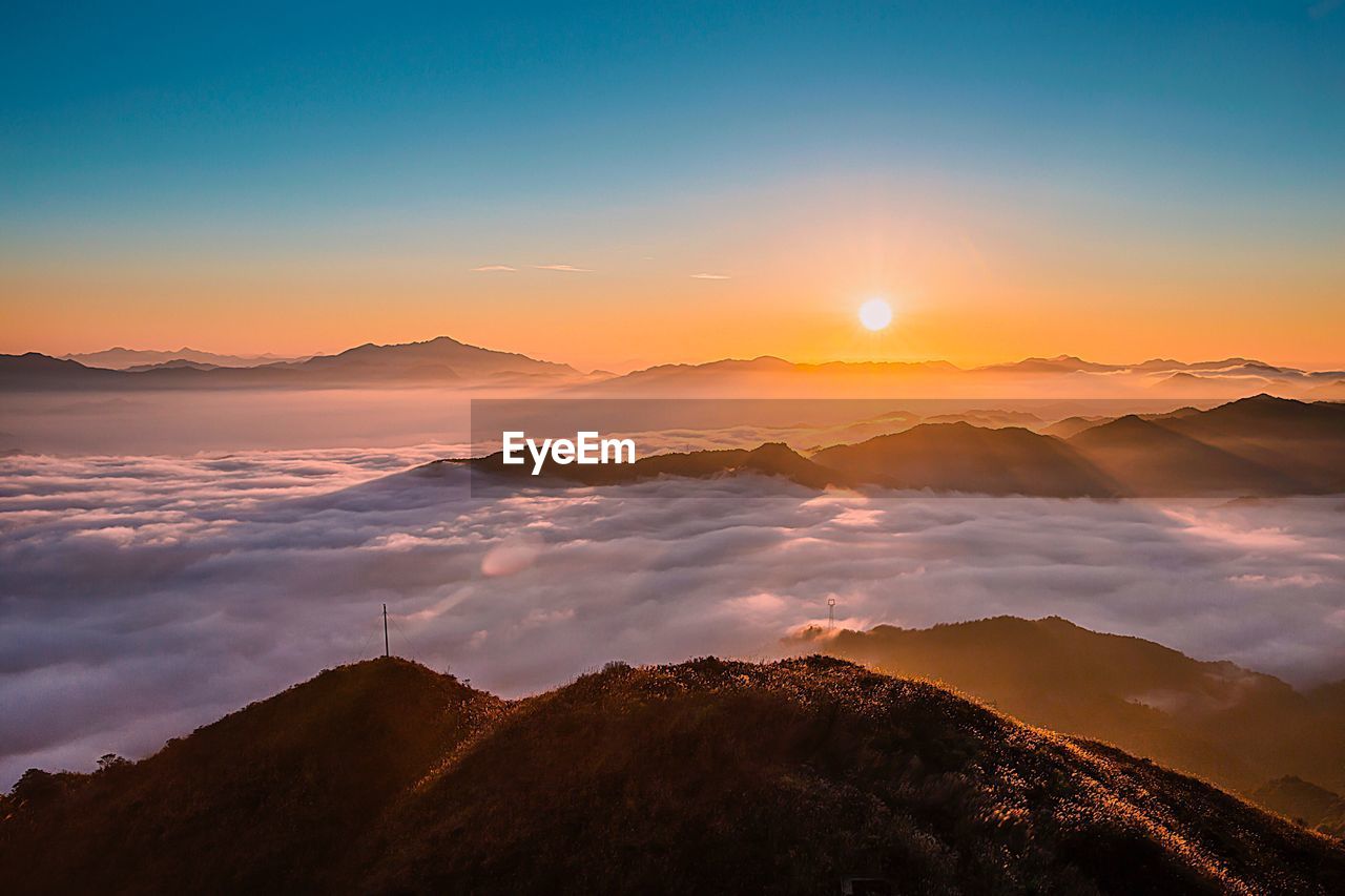 Scenic view of mountains against sky during sunset